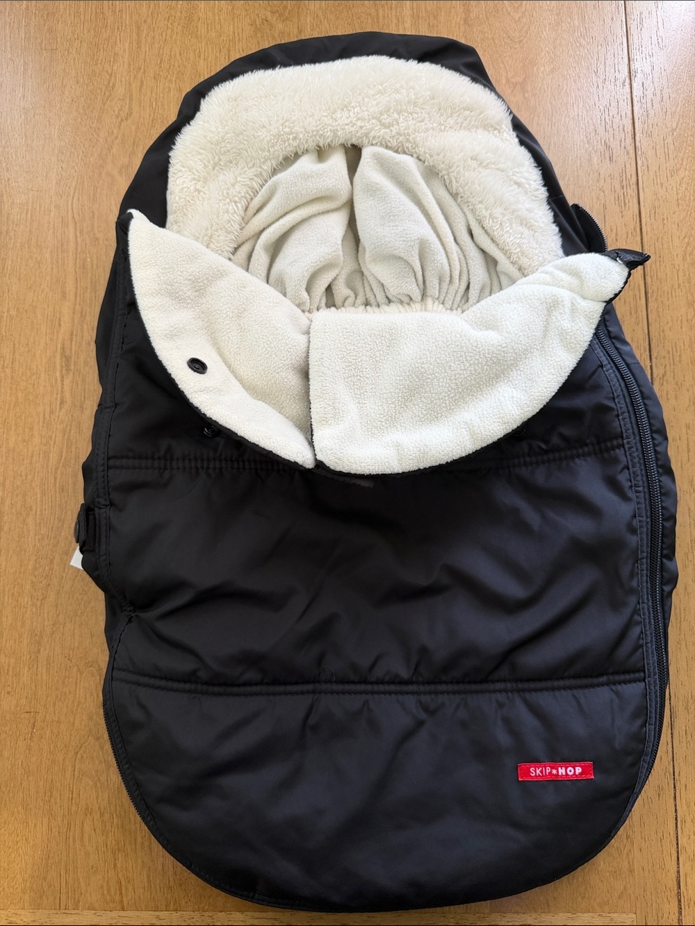 Skip Hop Black and Cream Infant Car Seat Cover.